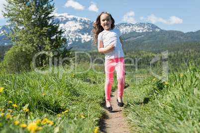 Portrait of cute girl having fun in field