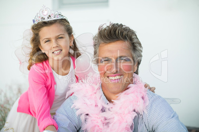 Smiling father and daughter in fairy costume