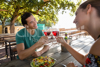 Happy friends toasting wineglasses