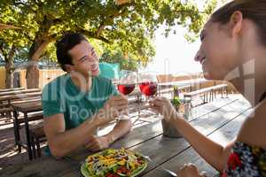 Happy friends toasting wineglasses