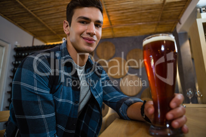 Portrait of man holding beer glass