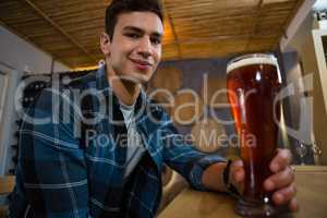 Portrait of man holding beer glass