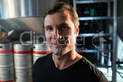 Portrait of worker standing at warehouse