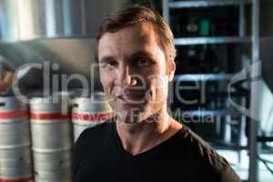 Portrait of worker standing at warehouse