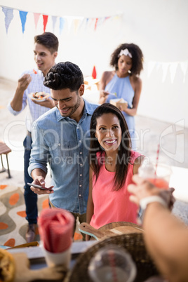 Customers giving order at food truck counter