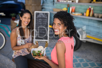 Happy friends having snacks