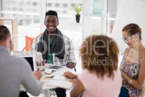 Male executive working with his coworkers in the office