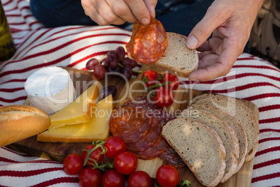 Mid-section of man having a meal