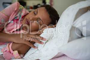 Woman sleeping on bed in the bedroom