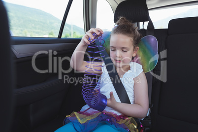 Girl playing with spiral accessories
