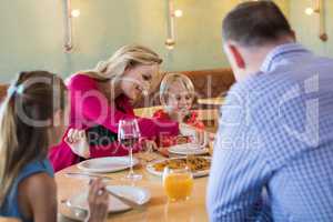 Family enjoying appetizer in restaurant
