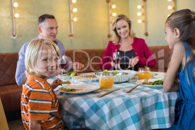 Portrait of boy with family at restaurant