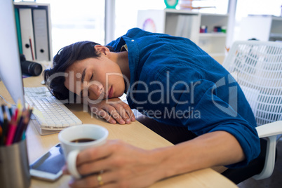 Male executive resting at his desk