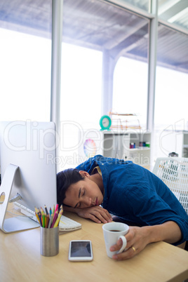 Male executive resting at his desk