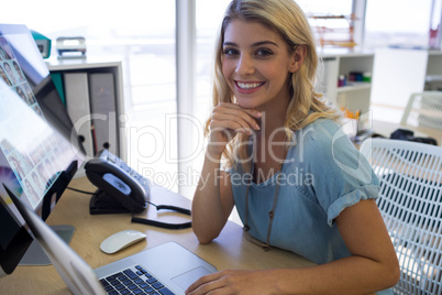 Female executive sitting at her desk