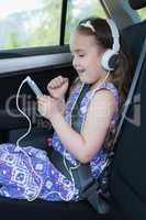 Girl listening music on mobile phone
