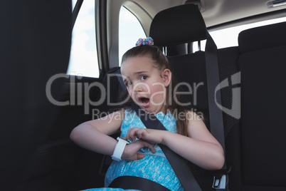 Cute girl adjusting smart watch