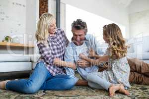 Happy family having fun in living room