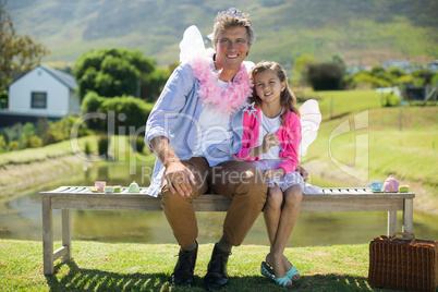 Smiling father and daughter in fairy costume