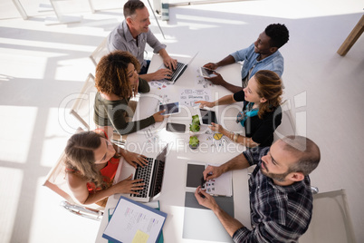 Executives interacting with each other during meeting