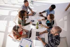 Executives interacting with each other during meeting