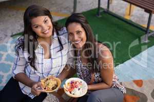 Happy friends having snacks