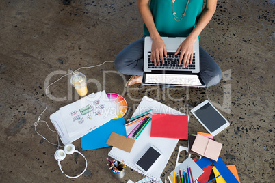 Female executive using laptop