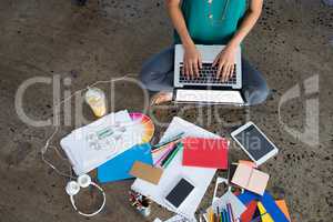 Female executive using laptop