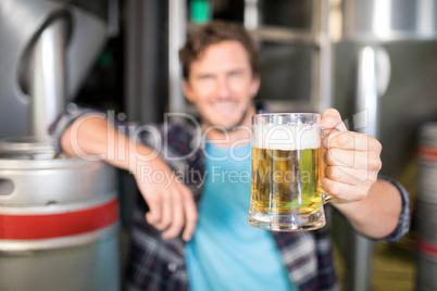 Close up of beer glass being held by worker