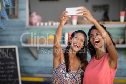 Friends taking selfie from mobile phone