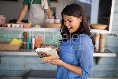 Woman looking at snacks at counter