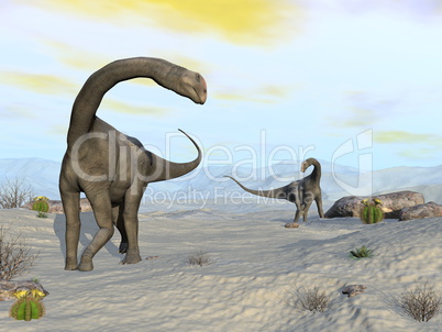 Brontomerus dinosaurs in the desert - 3D render