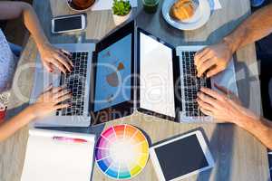 Executives using laptop at their desk