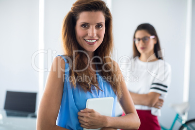 Female executive holding digital tablet in office