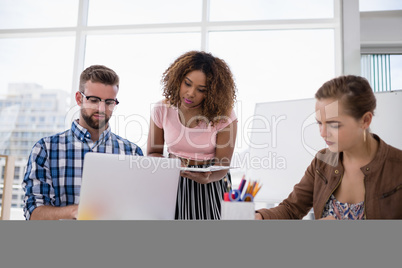 Team of executives working together in the office