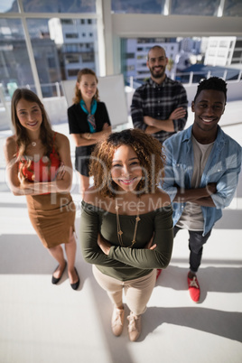 Group of colleagues standing with arms crossed