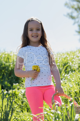 Portrait of cute girl holding fresh flowers