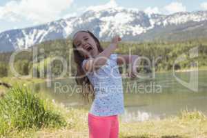 Portrait of cute girl having fun near river