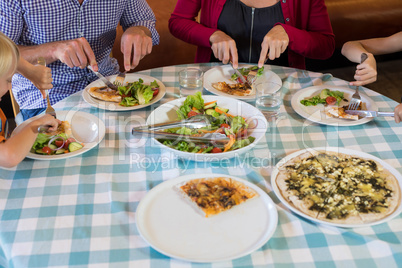 Family eating food at restaurant