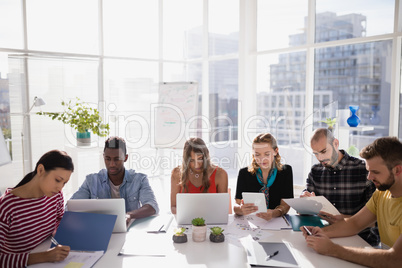 Business executives working in office Business executives working in office