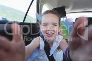 Cute girl enjoying in car