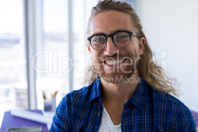 Male architect smiling in office