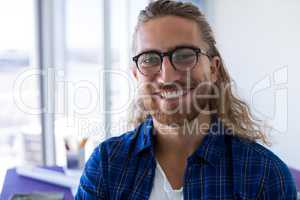 Male architect smiling in office