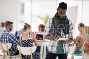 Male executive using digital tablet in the office