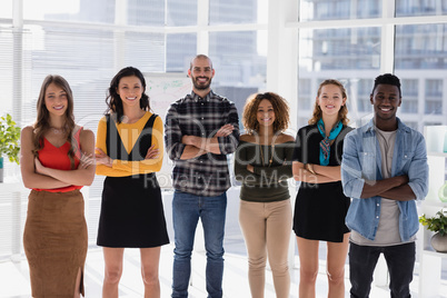 Group of colleagues standing with arms crossed