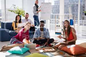 Business colleagues having pizza together in the office