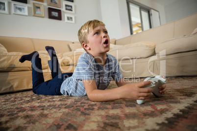 Boy playing video game in the living room