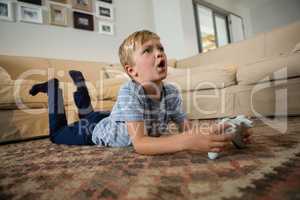 Boy playing video game in the living room