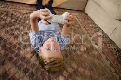 Boy playing video game in the living room