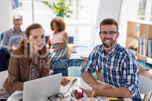 Male and female executives working together in the office